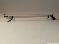 Full view of 32-inch reacher on countertop