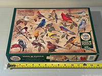 Puzzle box top showing artwork and branding