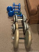 Row of nine dumbbells showing overall lot