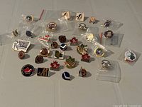 All 32 hockey enamel pins laid out on table