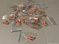 Pile of individually bagged ODHA pins on table