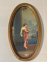 Full view of oval framed print