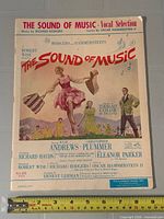 Front cover showing title, credits, artwork, ruler for scale