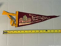Full view of pennant with ruler showing length
