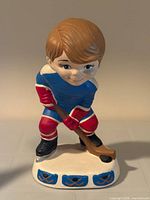 Front view of ceramic hockey player figurine