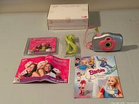 Complete set laid out: camera, cable, software CD, user guide, catalog, box