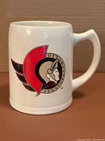 Front view showing Ottawa Senators crest on stein