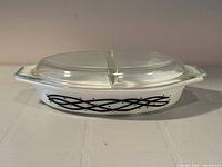 Side view showing casserole, lid, pattern