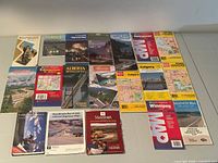 All 19 folded maps laid out on table