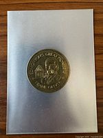 Obverse showing portrait of Frank Oliver and edge detail