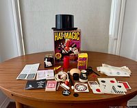 Full contents laid out with top hat, box and accessories visible