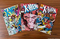 Front covers of three X-Men comic books issues 3, 4, 7