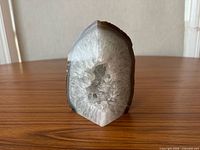 Front view showing polished face and crystal cavity