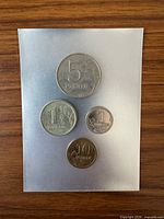 Obverse view of all four coins showing denominations