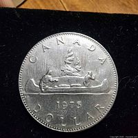 Reverse showing CANADA 1975 DOLLAR and voyageurs in canoe