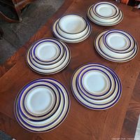 Full set of plates and bowls on table
