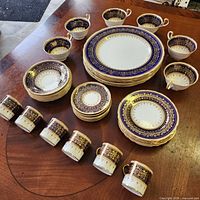 Full set arranged on table showing plates, cups and saucers