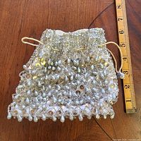 Front view with ruler showing size and bead detail