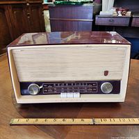 Front view of Grundig Model 88 CA radio with ruler for width