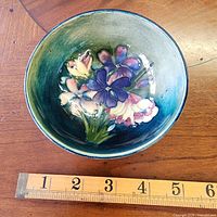 Interior view showing hand-painted floral motif and gradient glaze