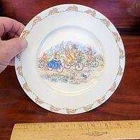 Full view of Bunnykins rim soup plate showing diameter scale