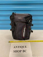 Front view of Garneau pannier showing logo, main zipper and straps