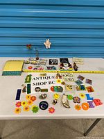 Wide view of all magnets and decor on table