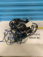 Both string light sets coiled on table