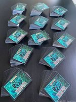 Sixteen stacks of cards showing teal Vampire card backs