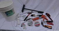 All items laid out including bucket, tools, accessories