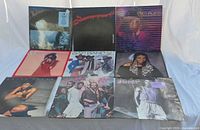 Front view of all nine LP sleeves laid out in three rows