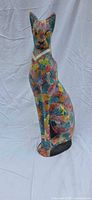 Front left view of multicolour papier-mâché cat coin bank with rhinestone collar
