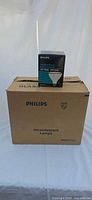 Outer Philips master carton with one inner box of bulb on top