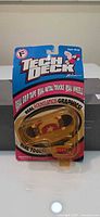 Front view of sealed Tech Deck Series 3100 fingerboard on card