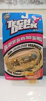 Front view of sealed Tech Deck Santa Cruz Series 3200 fingerboard on blister card