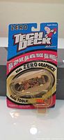 Front view of unopened Tech Deck ZERO fingerboard in blister pack