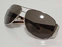 Front three-quarter view of Prada SPR 75G sunglasses