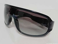 Front three-quarter view showing frame shape, lens tint, temple rib detail