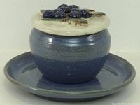 crock jar on saucer with blueberry lid