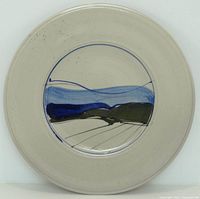 Front of charger showing painted landscape design