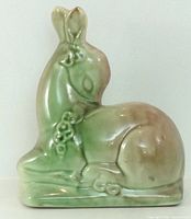 front left view of glazed ceramic fawn showing overall form and gradient glaze