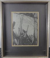 Frontal view of framed black-and-white photograph