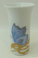 Front view showing butterfly and gold motif