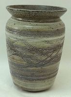 Full view of vase showing form, glaze and incised decoration