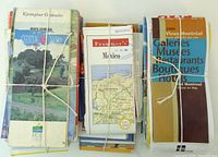 Front view showing three bundles of folded maps with visible covers