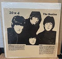 Front sleeve with beige insert showing Beatles silhouette and title 20 x 4
