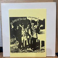 Front of white sleeve with yellow insert showing Beatles photo and title