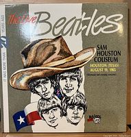 Front laminated album cover showing title, illustration and venue/date