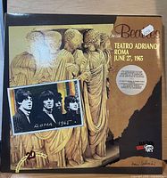 Front laminated sleeve with title, date and venue