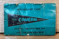 Front cover showing Cavern Club logo, expiry date and overall wear